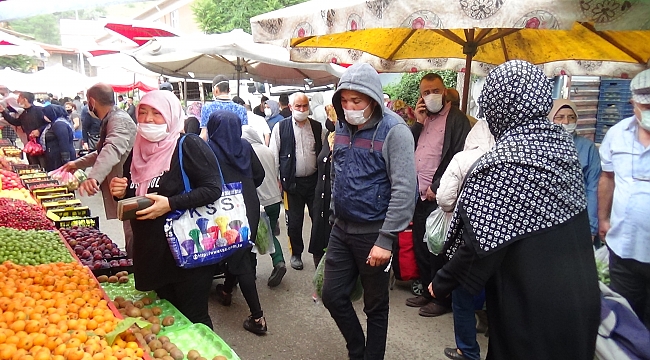 SOKAĞA ÇIKMA YASAĞINA SAATLER KALA PAZARLARDA YOĞUNLUK