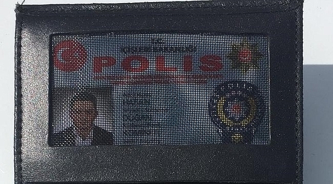SAHTE POLİS KİMLİĞİYLE YAKALANDI