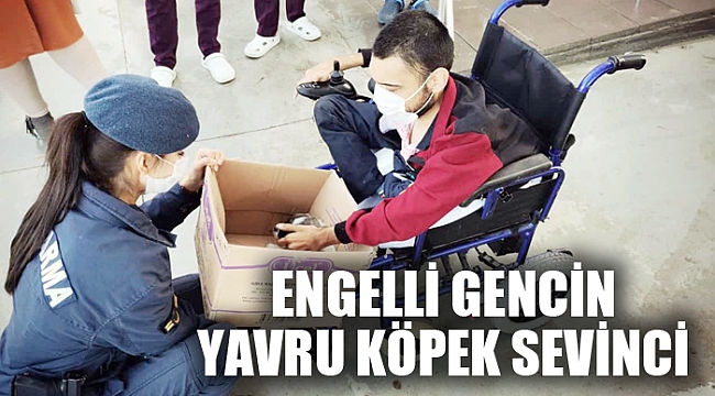 ENGELLİ GENÇ YAVRU KÖPEĞİNE KAVUŞTU