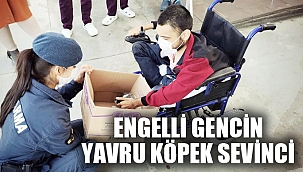 ENGELLİ GENÇ YAVRU KÖPEĞİNE KAVUŞTU