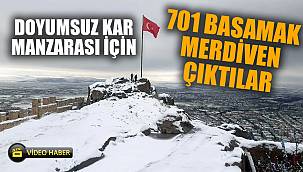 Kar altında kalan kenti 226 metre yükseklikten seyrettiler 