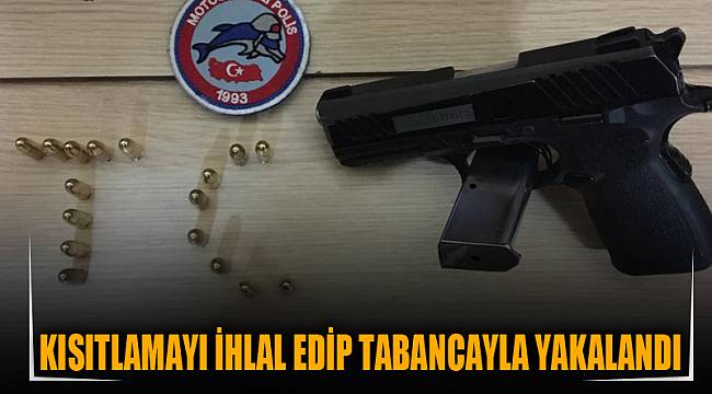 Kısıtlamayı ihlal edip tabancayla yakalandı