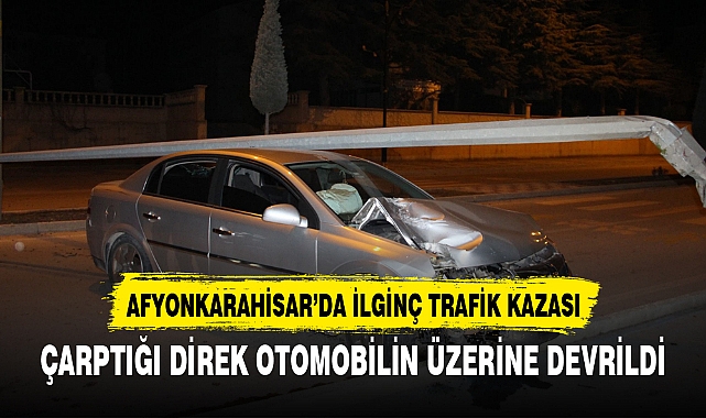 ÇARPTIĞI DİREK OTOMOBİLİN ÜZERİNE DEVRİLDİ