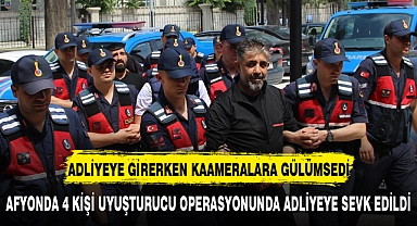 ADLİYEYE GİRERKEN KAMERALARA GÜLÜMSEDİ