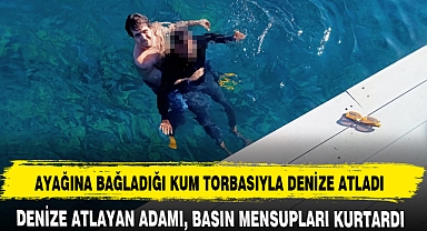 AYAĞINA BAĞLADIĞI KUM TORBASIYLA DENİZE ATLADI