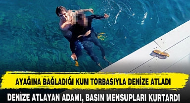 AYAĞINA BAĞLADIĞI KUM TORBASIYLA DENİZE ATLADI