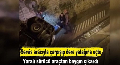 Servis aracıyla çarpışıp dere yatağına uçtu