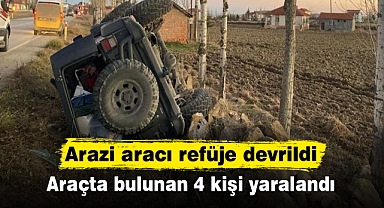 Arazi aracı refüje devrildi