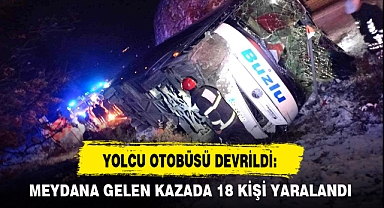 YOLCU OTOBÜSÜ DEVRİLDİ: