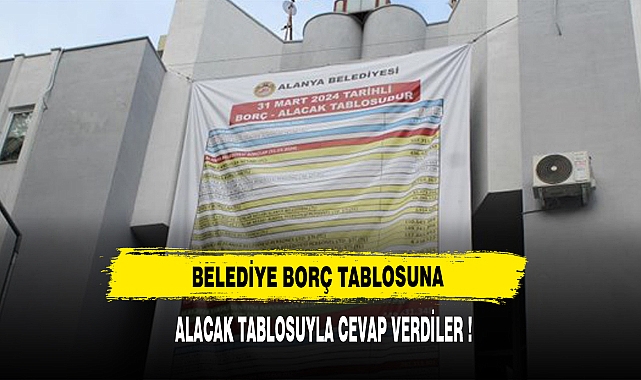 Belediyenin borç afişine MHP'den alacak kalemli afişle cevap