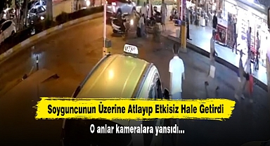 Soyguncunun Üzerine Atlayıp Etkisiz Hale Getirdi! O anlar kameralara yansıdı…