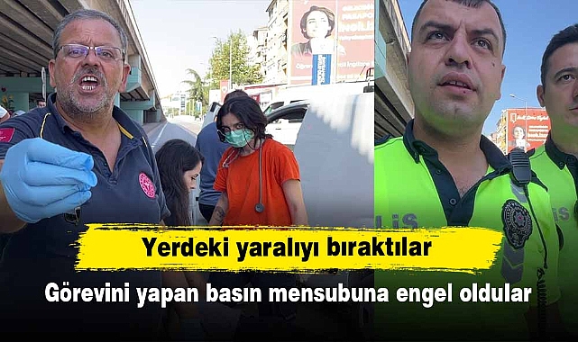 Yerdeki yaralıyı bırakıp, görevini yapan basın mensubuna engel oldular